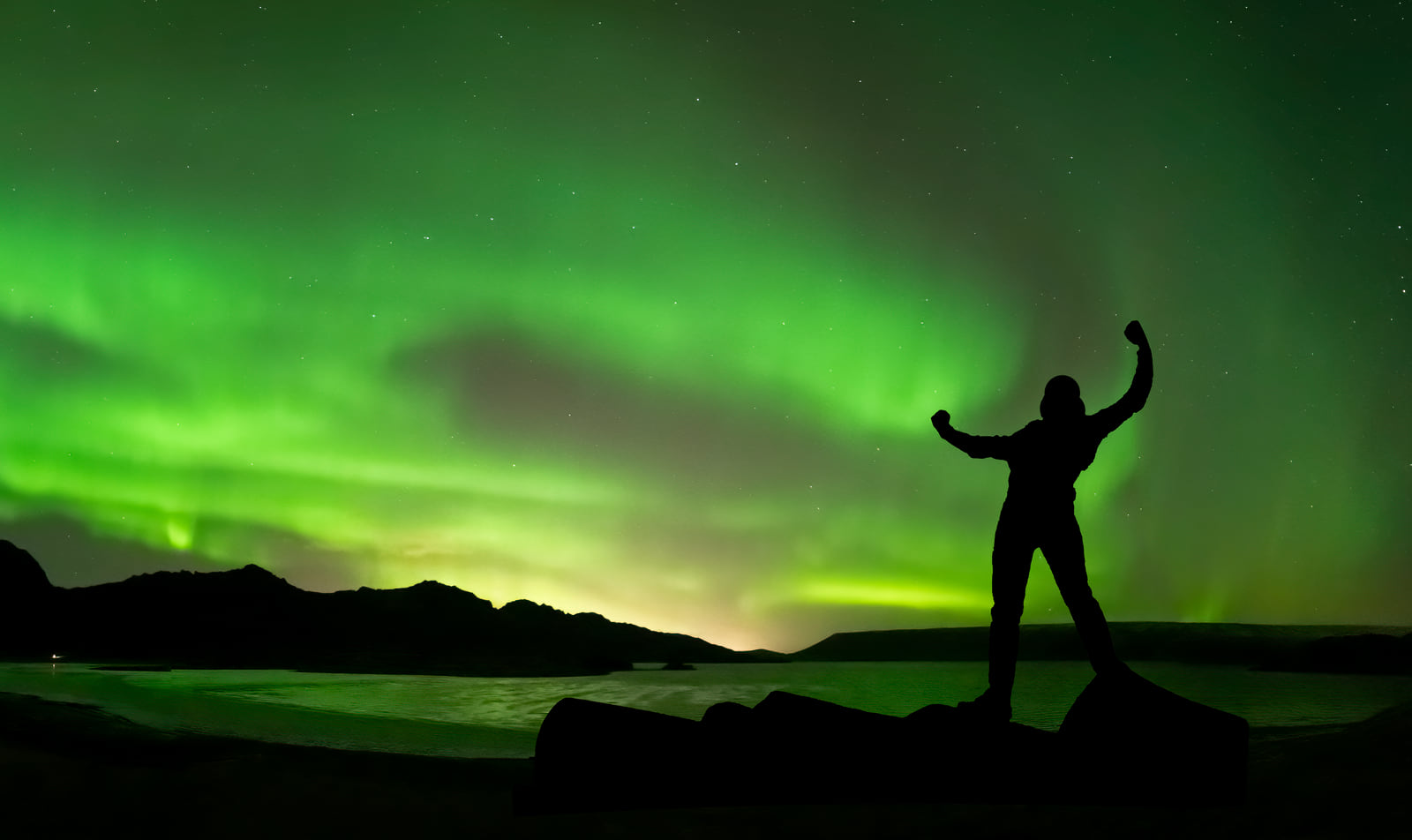 Person celebrating the Northern Ligths