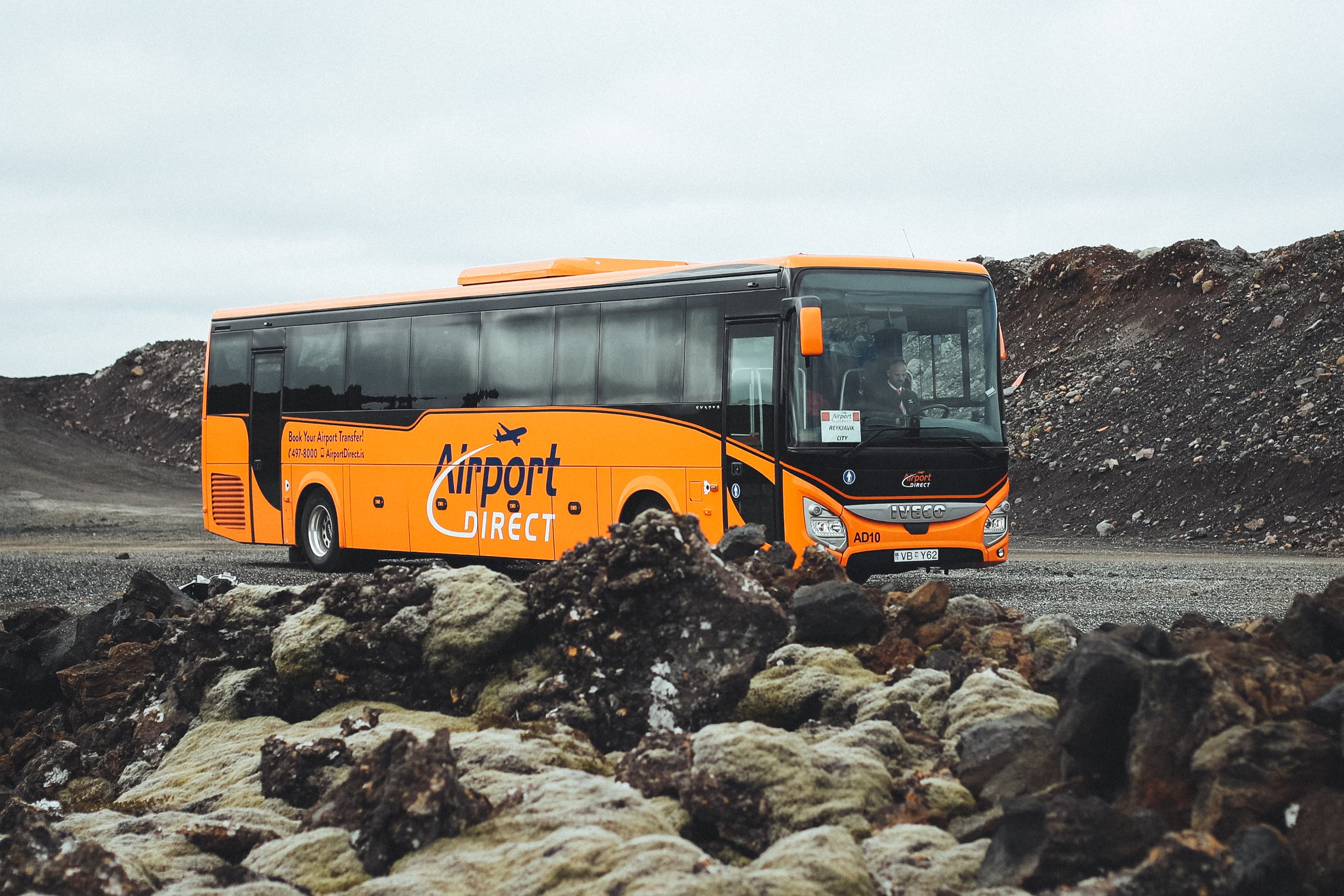 Airort direct bus on a road through a lava field