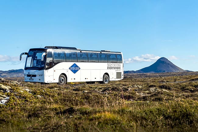 Gray-Line-airport-shuttle-bus-and-Keilir-mountain.jpg