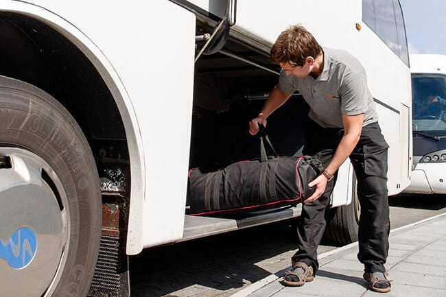 Gray-Line-bus-driver-helping-with-luggage.jpg