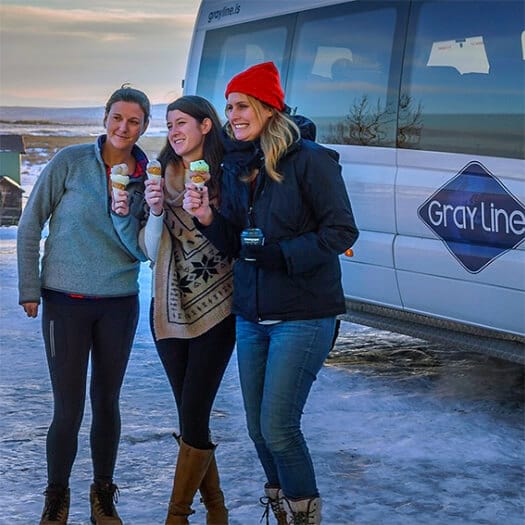 Three women holding ice cream cones