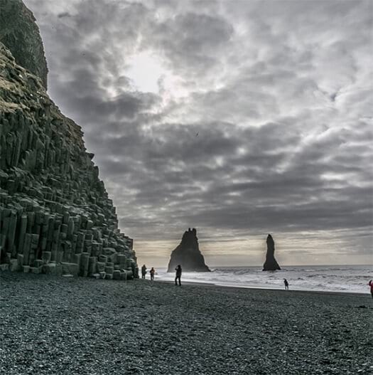 Reynisdrángar rock formation and black sand beach