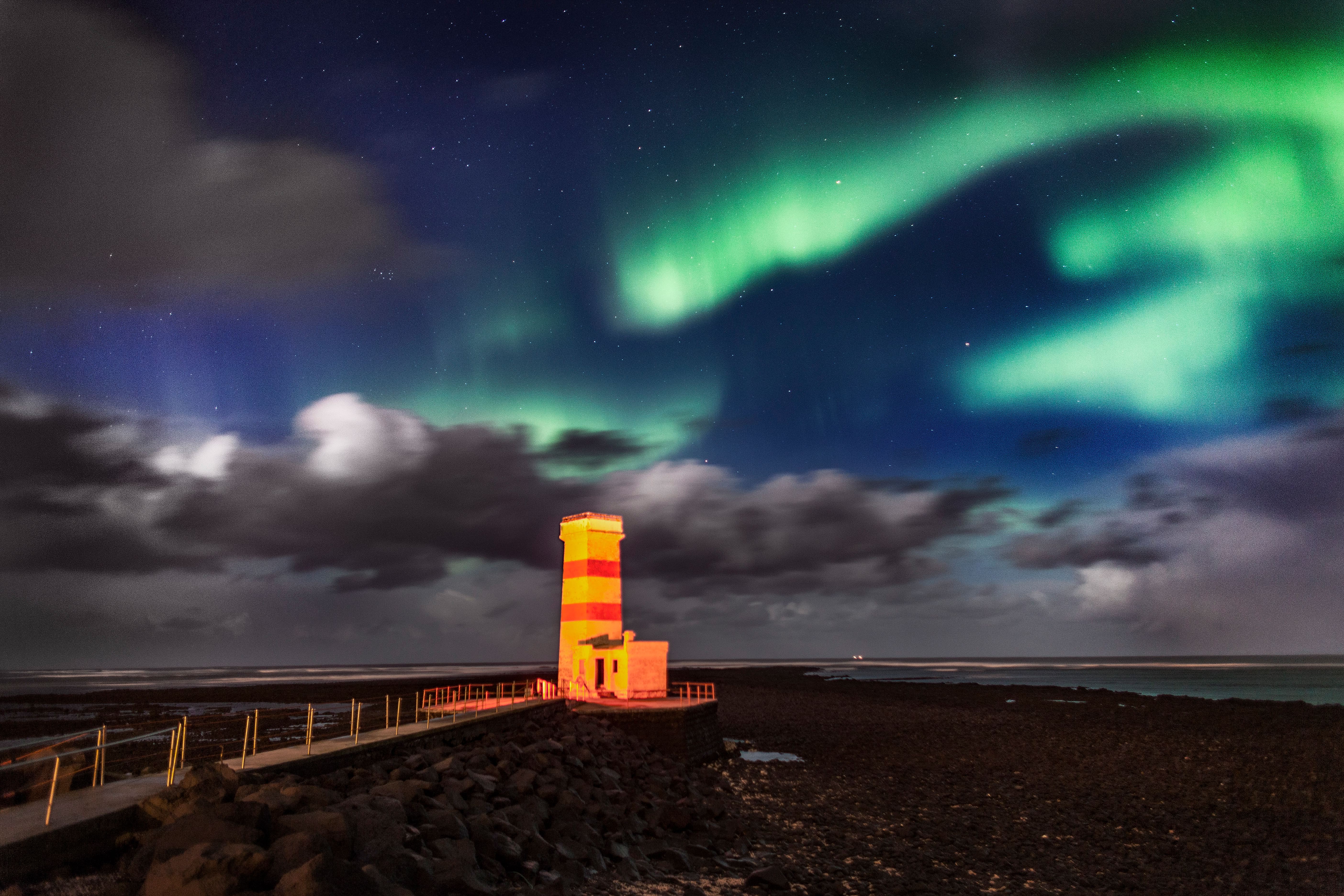 Northern Lights in Iceland with a light house