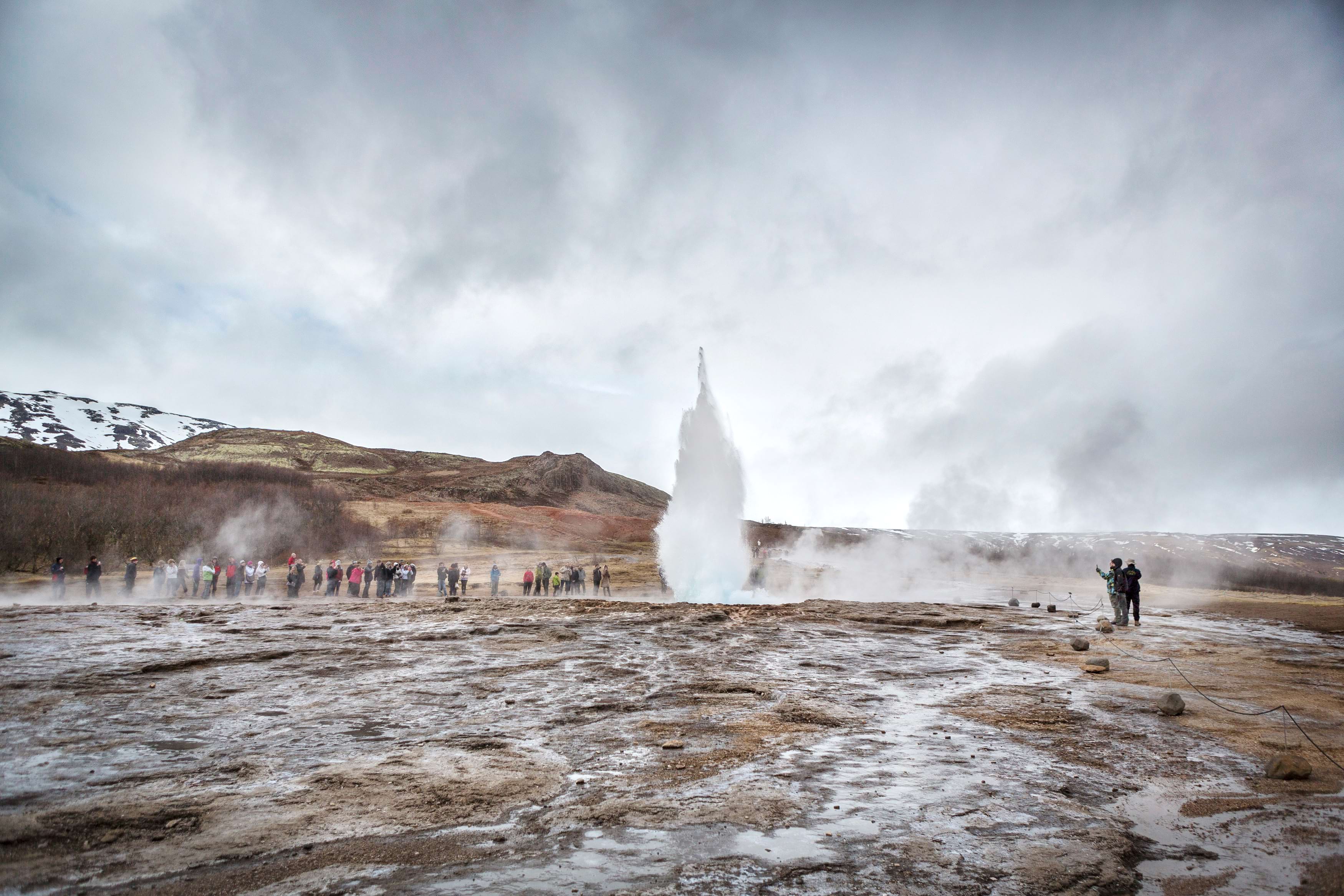 People looking at Geysir in Iceland