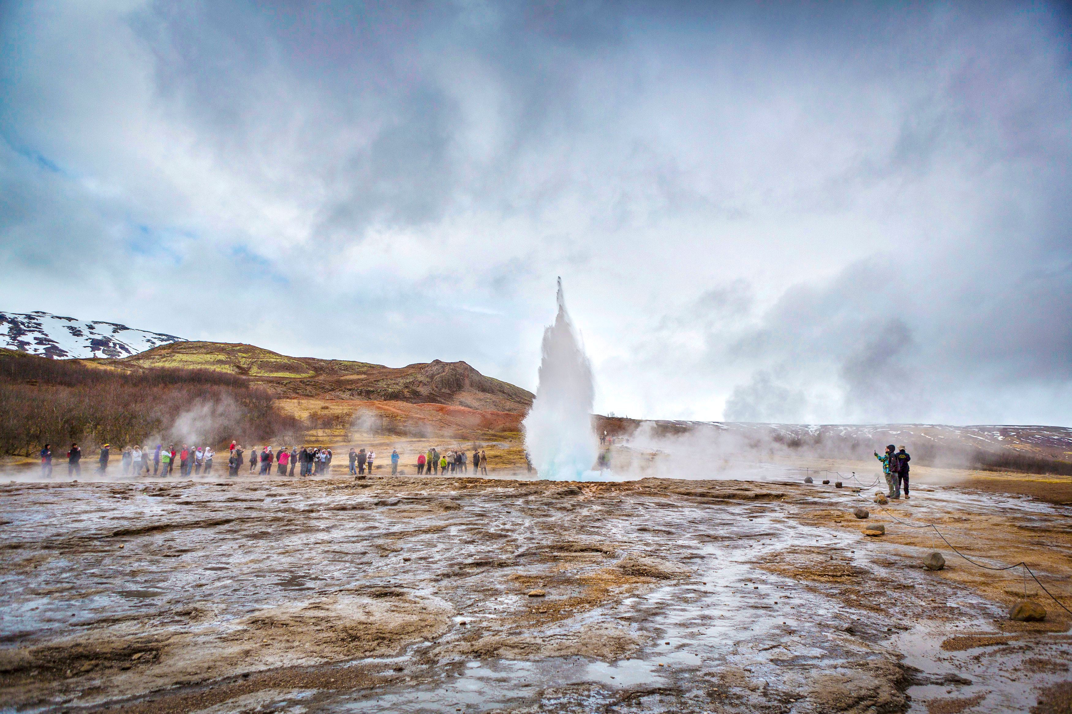 People looking at Geysir in Iceland