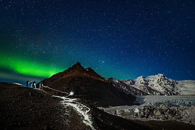 People-taking-pictures-of-northern-lights-at-glacier.jpg