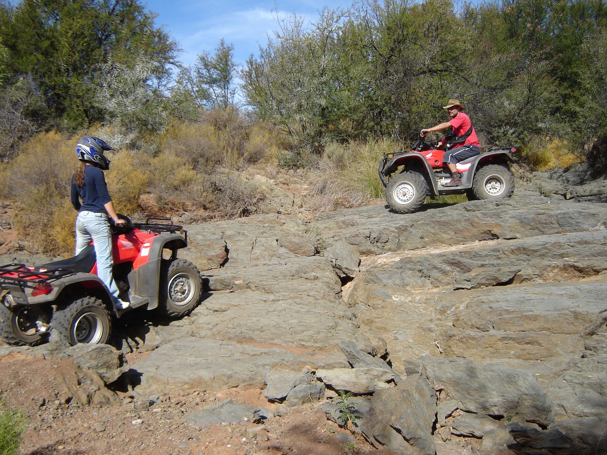 Teenager Beth and her dad on quad bikes