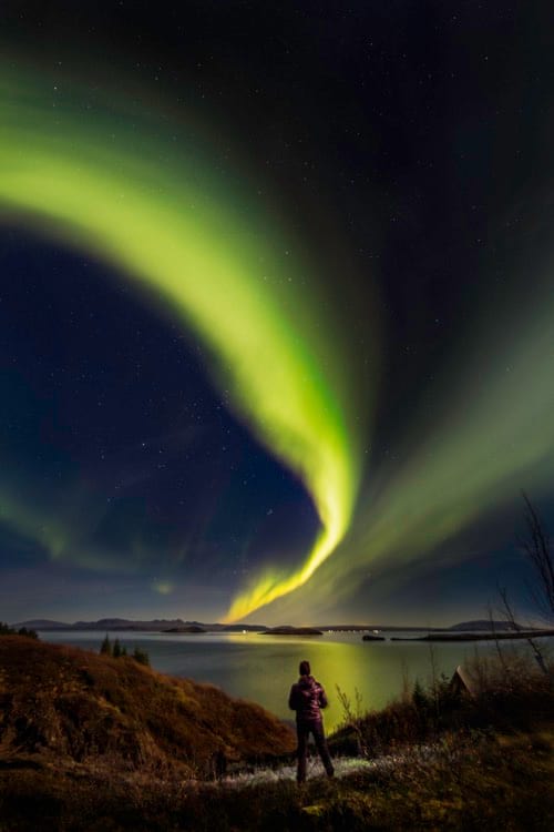 green-northern-lights-over-a-lake