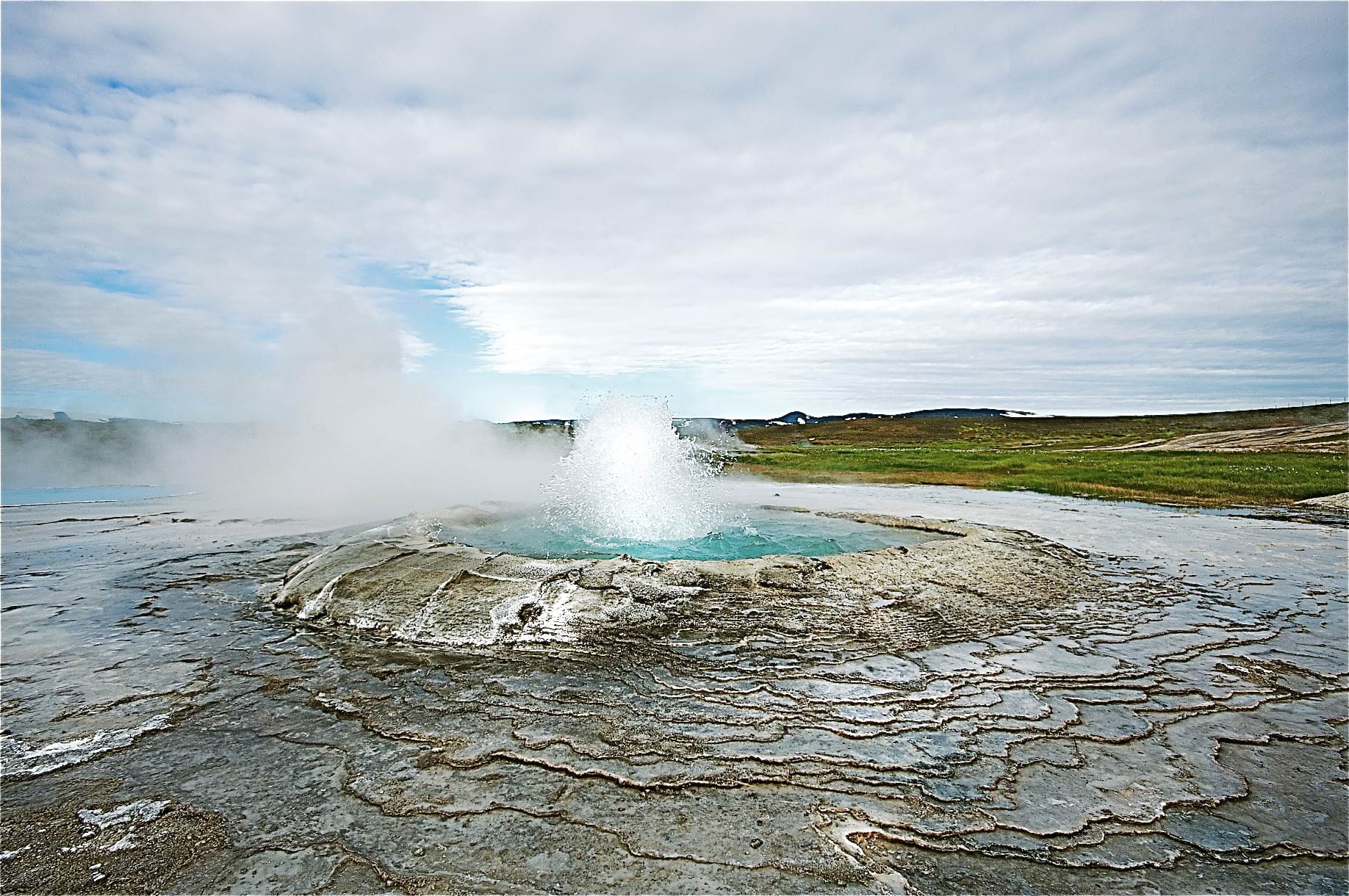 People looking at Geysir in Iceland